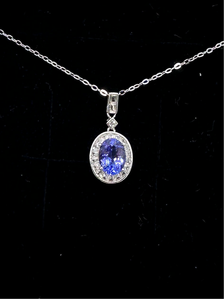Tanzanite halo pendant set in sterling silver